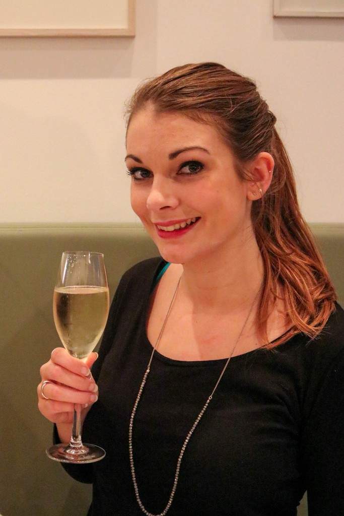 Alba Restaurant Review - Eppie with glass of white wine