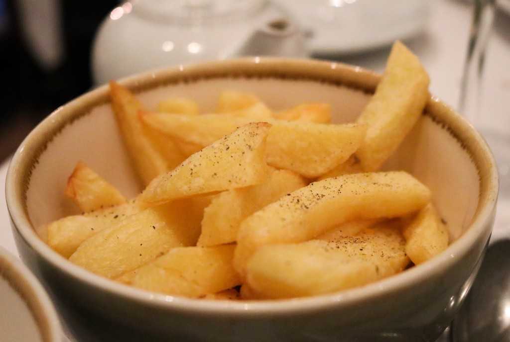 Alba Restaurant Review - a bowl of yellow chunky chips